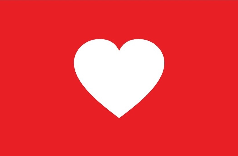 Logo Purina Agit pour les communautés avec le cœur blanc sur fond rouge